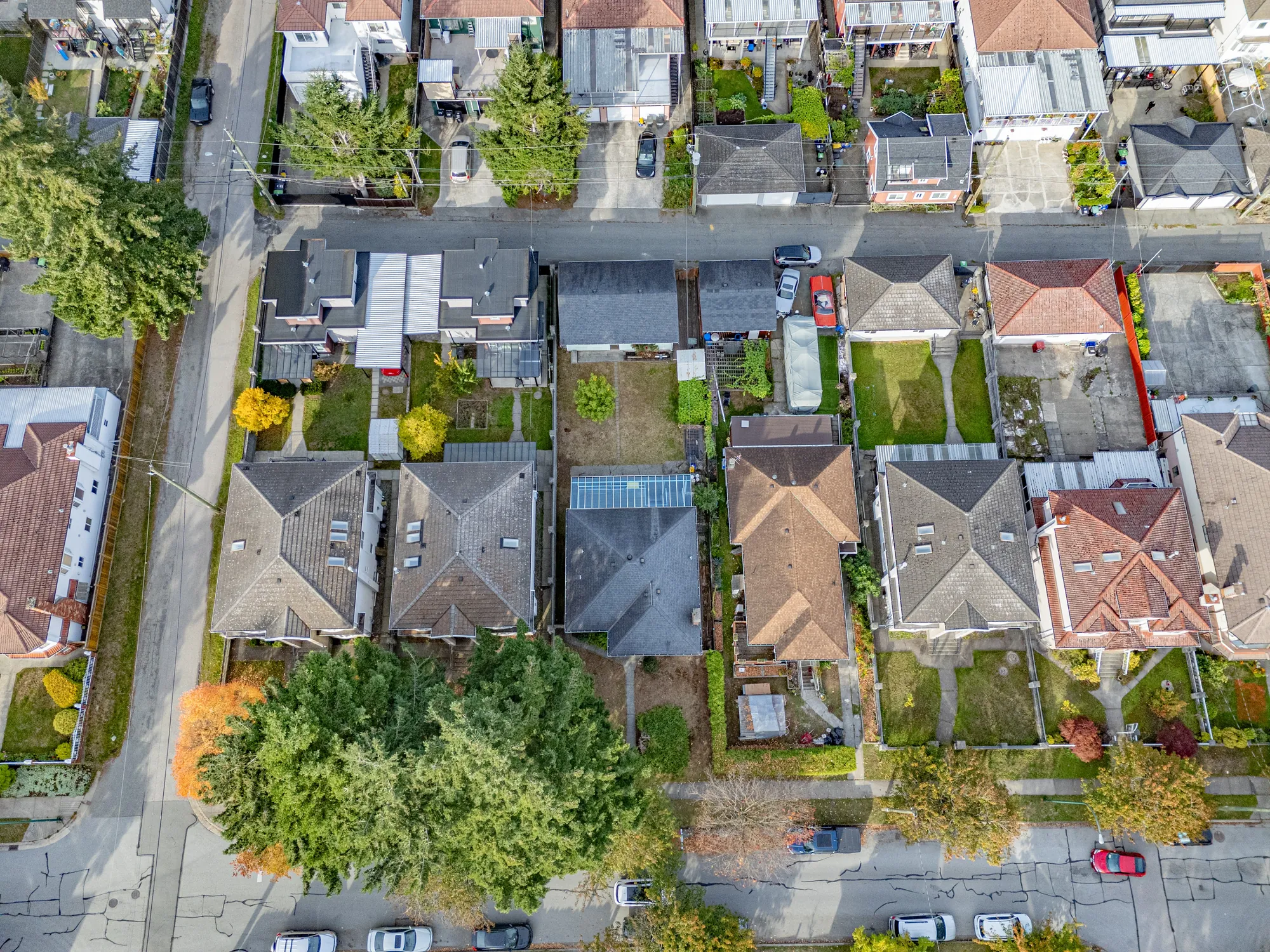 Looking down on the block: the street, the lane and the back yards with their garages