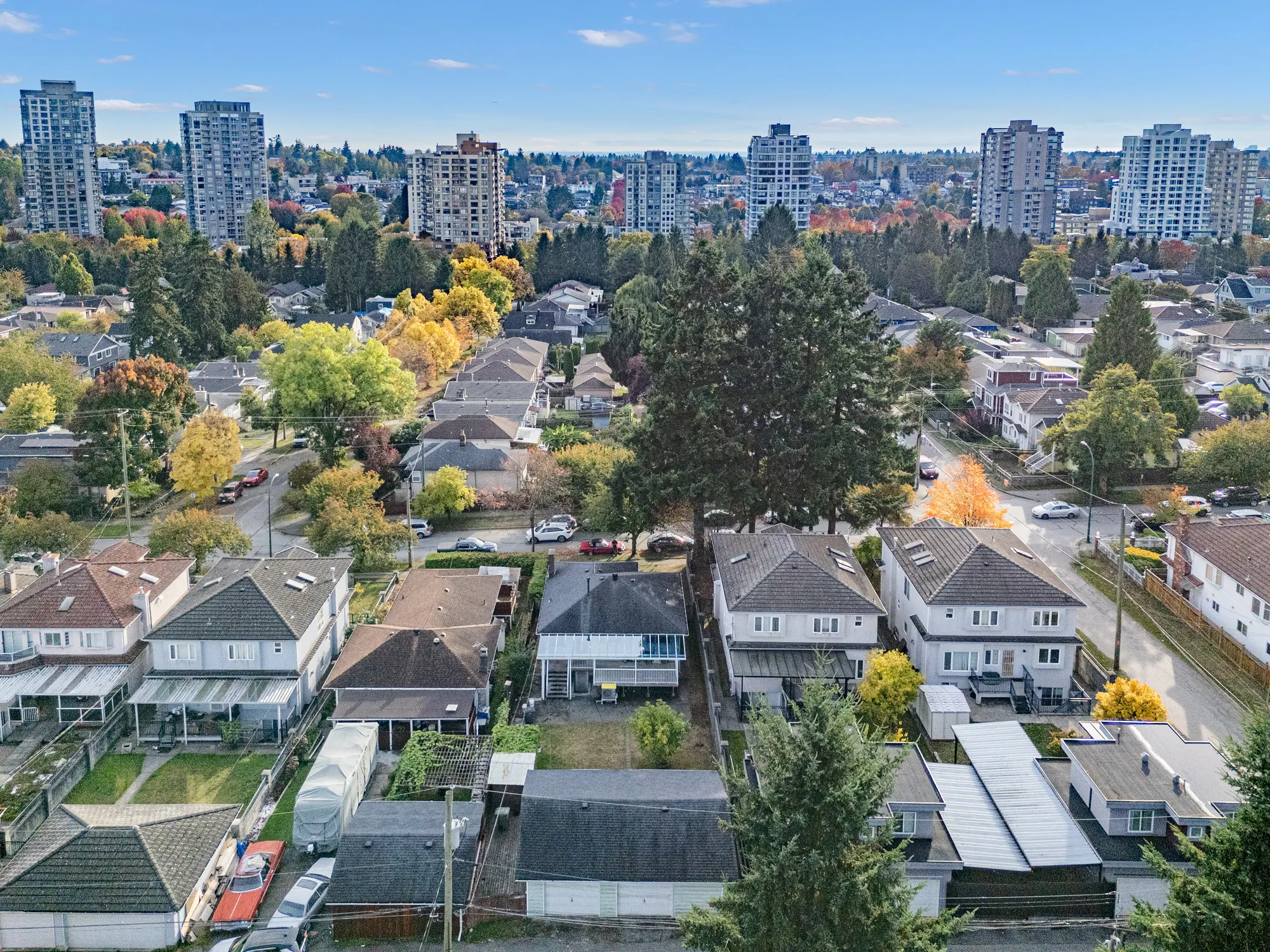 Over the neighbouring houses toward a cluster of towers